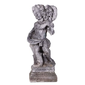 A CAST STONE GARDEN CHERUB RAISED ON PLINTH BASE.