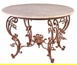 ITALIAN SCROLL FORM WROUGHT IRON GARDEN TABLE HAVING CENTRAL BASKET OF FLOWERS AND MARBLE TOP