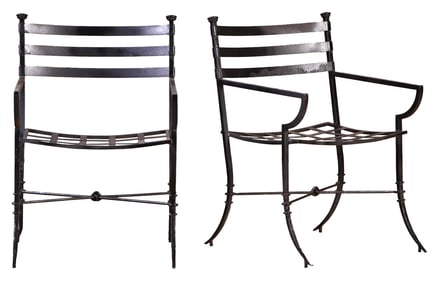 PAIR OF WROUGHT IRON ARM CHAIRS WITH LOOSE CUSHIONS IN THE MANNER OF GIACOMETTI.