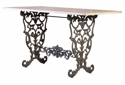 LATE NINETEENTH CENTURY CAST IRON GARDEN TABLE HAVING A MARBLE TOP.