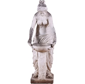 A LIFE-SIZE CAST STONE STATUE OF A CLASSICAL WOMAN OVER A BIRD BATH CIRCA 1940.