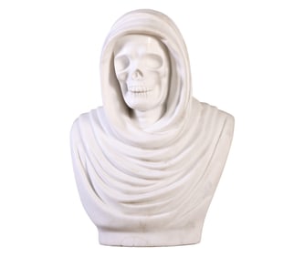 A CARVED MARBLE SKULL DRAPED IN FABRIC.