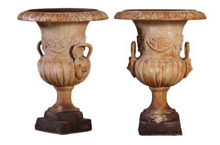 PAIR OF 29" CAST IRON GARDEN URNS HAVING SWAG AND LION MASK DECORATION.