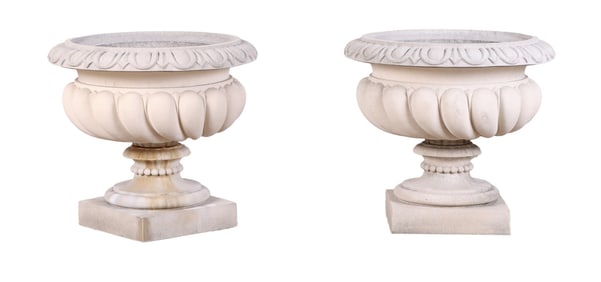 PAIR OF TWO PART CAST STONE GARDEN URNS BY HADDONSTONE HAVING EGG AND DART DETAILS.