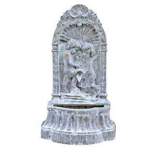 A LARGE CAST BRONZE WALL FOUNTAIN DEPICTING YOUNG LOVERS POURING FROM A JUG INTO A BASIN.: A large cast bronze wall fountain depicting young lovers pouring from a jug into a basin. Ht: 71" Wd: 31.5" Dpth: 31"