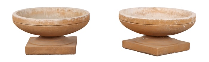 A PAIR OF ROUND CAST STONE ART DECO STYLE PLANTERS.