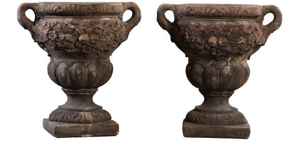 PAIR CAST STONE PAIR OF PLANTERS HAVING HANDLES AND FRUIT DECORATION.