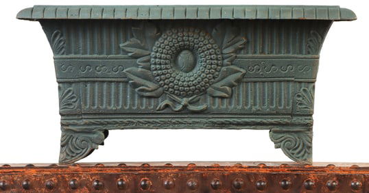 RECTANGULAR FOOTED AND DECORATED CAST IRON PLANTER.