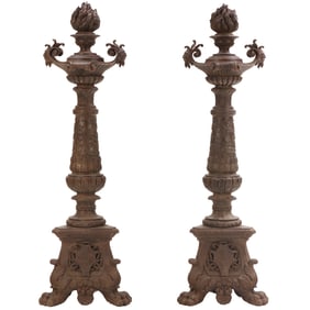 ONE OF TWO PAIRS OF ITALIAN CAST IRON TORCHIERES ON PAW FEET, 19TH CENTURY