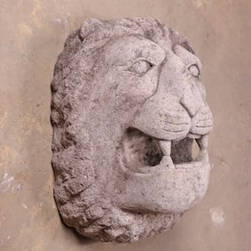 ONE OF TWO 26" CARVED STONE WALL MOUNT LION FACES,