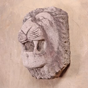ONE OF TWO 26" CARVED STONE WALL MOUNT LION FACES,
