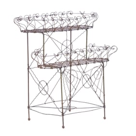 A VICTORIAN STYLE WIRE PLANT STAND.