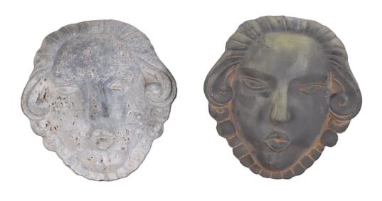 TWO LEAD WALL HUNG FEMALE MASKS.