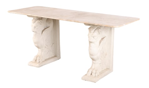 A CONSOLE TABLE HAVING A MARBLE TOP RESTING ATOP TWO CAST STONE MUYTHOLOGICAL CREATURES.