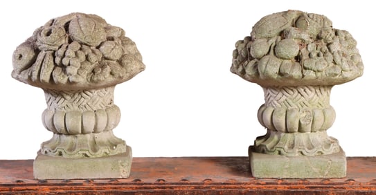 A PAIR OF CAST STONE CORNUCOPIA.
