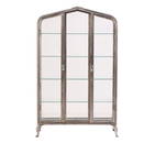 A POLISHED STEEL AND GLASS VITRINE HAVING PEAKED TOP CIRCA 1930.