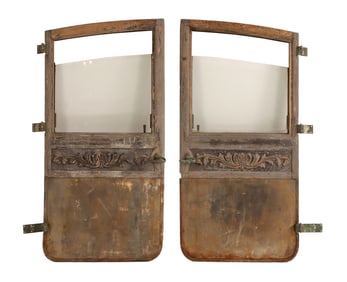 A PAIR OF BELGIAN CARRIAGE DOORS HAVING HANDCARVED CARVED WOOD FRIEZE, BRONZE HANDLES AND