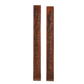 PAIR LATE NINETEENTH CENTURY OAK CARVINGS OF FLOWERS HANGING FROM A RING.