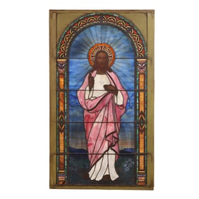 A LARGE ANTIQUE STAINED GLASS WINDOW DEPICTING JESUS.