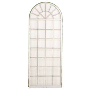 A LARGE PAINTED IRON AND GLASS FRENCH PALLADIUM WINDOW.: A large painted iron and glass French palladium window hinged to its frame C 1930. Ht: 98" Wd: 38.75"