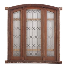 AN ANTIQUE WOOD AND LEADED GLASS LANDING WINDOW CIRCA 1900.