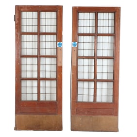 A PAIR OF ANTIQUE ENGLISH MAHOGANY LEADED GLASS DOORS WITH BRASS KICK PLATES CIRCA 1910, REMOVED