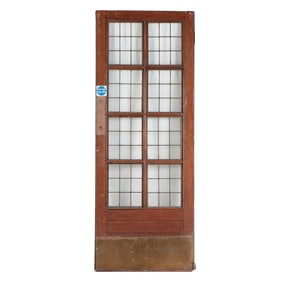 AN ANTIQUE ENGLISH MAHOGANY LEADED GLASS DOOR WITH BRASS KICK PLATE CIRCA 1910, REMOVED FROM A