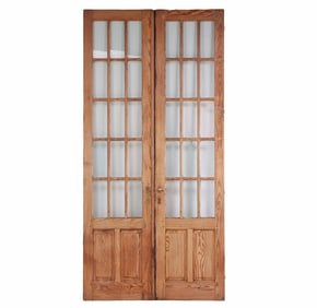 A PAIR OF ANTIQUE PINE WOOD AND GLASS FRENCH DOORS.