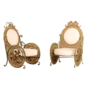 A PAIR OF WROUGHT IRON GARDEN CHAIRS HAVING CIRCULAR DESIGN AND ELABORATE SCROLL WORK