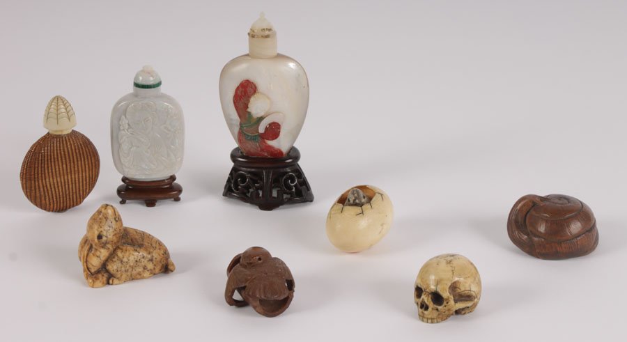 ASIAN ANIMAL NETSUKES SNUFF BOTTLES IVORY BONE: Five netsukes made of ivory, bone and wood along with three snuff bottles made of ivory, mother of pearl and opal. 5 netsukes consisting of: an ivory skull (1"), a hatching egg in which the chick move