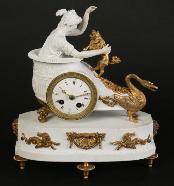 DETAILED PARIAN DORE BRONZE FRENCH CLOCK: A nicely detailed Parian and dore bronze time and strike French clock having a classical female figure playing with dog circa 1880. Ht: 11" Width: 9" Depth: 4"