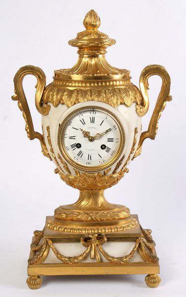 ALABASTER DORE BRONZE MANTLE CLOCK SIGNED: An impressive alabaster and dore bronze urn shaped French mantle clock signed "Marquis A Paris" with handpainted porcelain dial circa 1880 Ht: 19" Width: 11" Depth: 7"