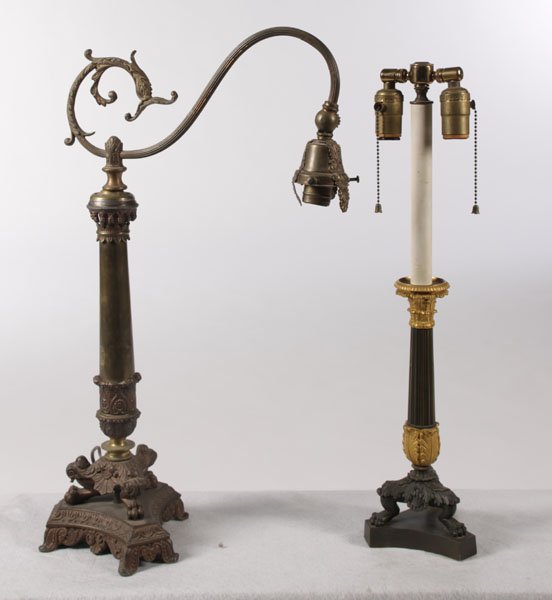 LOT 2 LAMPS EMPIRE COLUMN DORE BRONZE: A lot of two lamps consisting of one Empire single arm column form lamp and a two-tone bronze two light fixture with Dore bronze mounts circa 1920. Both lamps with lion paw feet. Ht: 24" Width: 7" Dep