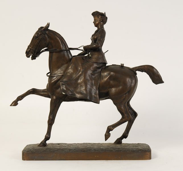 WHITE METAL STATUE OF WOMAN ON HORSE CIRCA 1920: A nicely detailed white metal statue featuring a woman sitting side saddle atop a steed circa 1920. Ht: 18" Width: 16" Depth: 5"