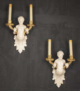 RARE PAIR WHITE MARBLE SATYR AND DORE BRONZE SCONCES: A matched pair of white marble and dore bronze satyr sconces having acanthus leaf carved bottoms circa 1900. Ht: 23" Width: 13" Depth: 4"