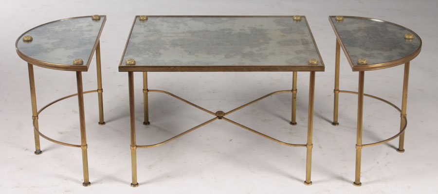 3 PC BRONZE PLATEAU STYLE COFFEE TABLE: A very good three piece bronze plateau style coffee table having distressed mirrored top with bronze rosette decoration circa 1960. Supported on reeded legs with x-form stretcher. Ht: 16.5" Width: 44"