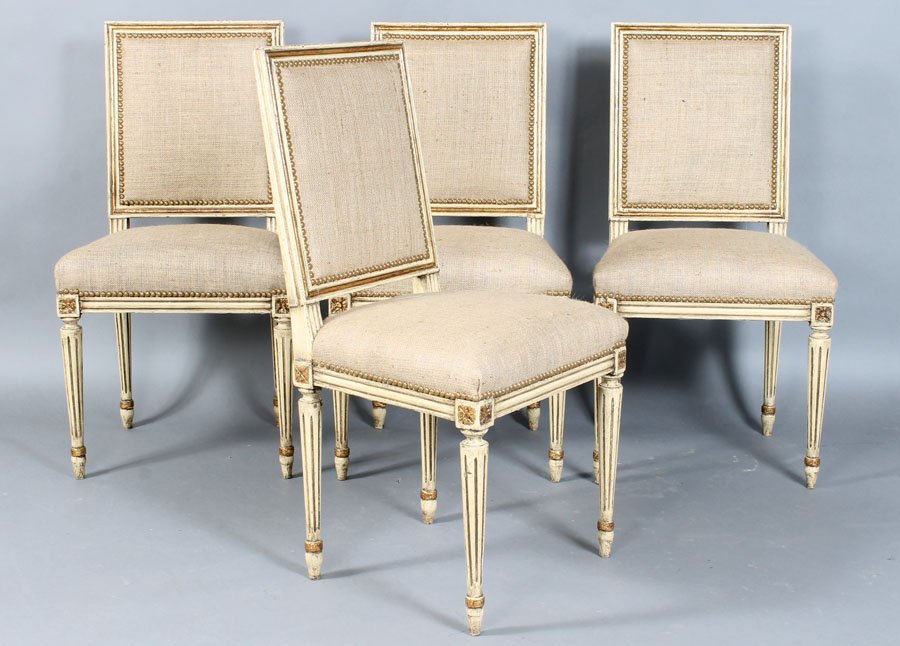 A SET OF 4 LOUIS XVI DINING CHAIRS CIRCA 1940: A set of four Louis XVI carved and painted dining chairs having upholstered back seat supported by fluted legs circa 1940. Ht: 36.5" Width: 21.5" Depth: 18.5"