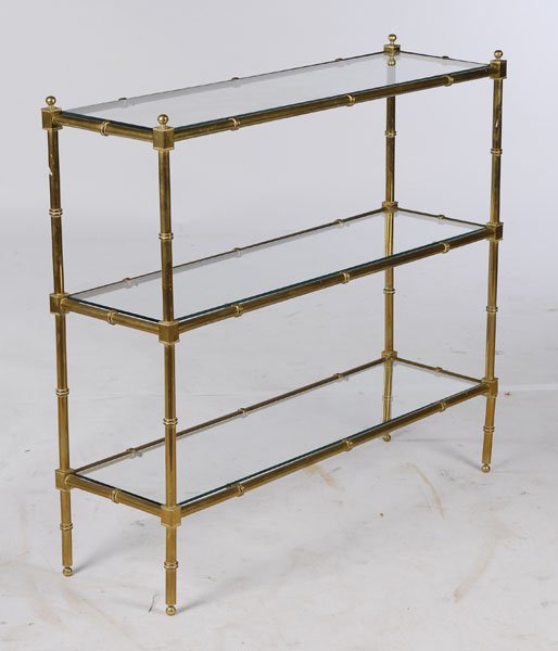 BRONZE FAUX BAMBOO SOFA TABLE 3 TIERS: A bronze faux bamboo sofa table having three tiers of glass shelves circa 1970. Ht: 36" Width: 39.5" Depth: 12"