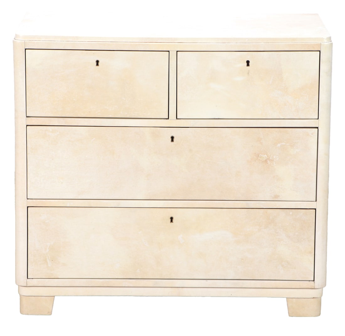FOUR DRAWER PARCHMENT COVERED DRESSER IN THE MANNER OF SAMUEL MARX C 1945.