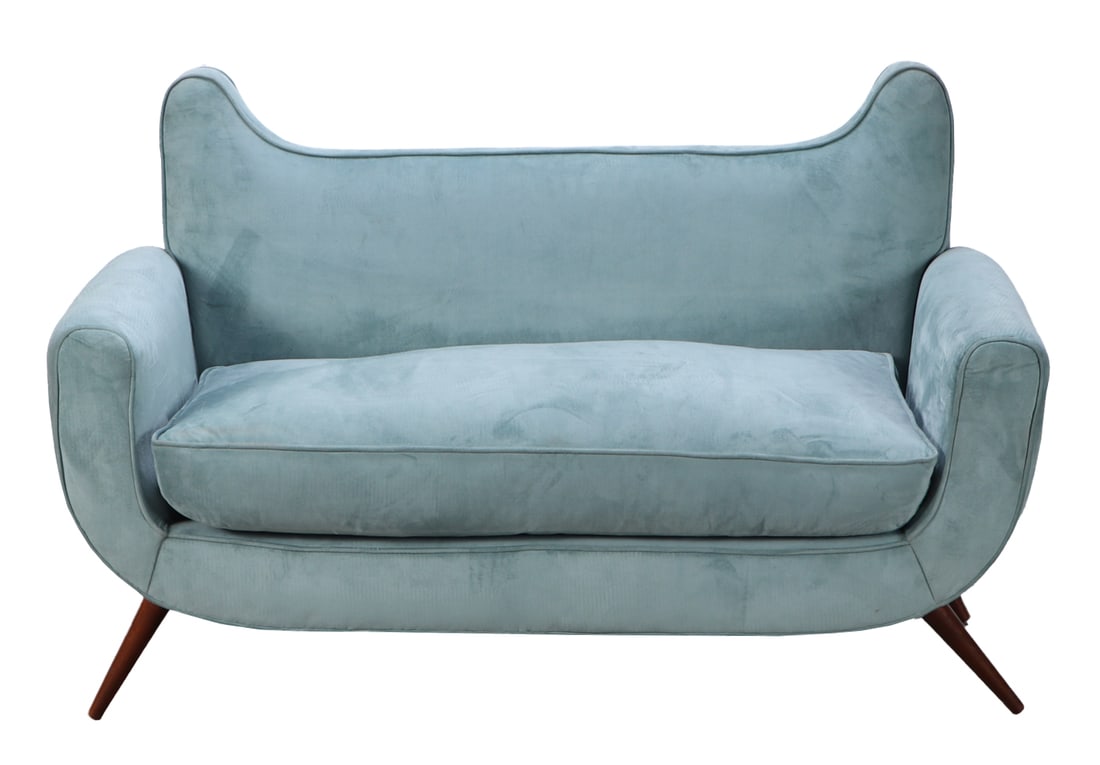AN UPHOLSTERED SETTEE IN THE MANNER OF ROBSJOHN-GIBBINGS RESTING ON WOODEN LEGS HAVING: An upholstered settee in the manner of Robsjohn-Gibbings resting on wooden legs having new fabric. Ht: 38.5" Wd: 60" Dpth: 29" Dia: 22"