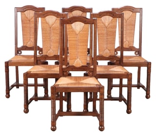 SIX FRENCH OAK DINING CHAIRS HAVING TURNED LEGS AND RUSH BACK AND SEATS IN THE MANNER OF CHARLES