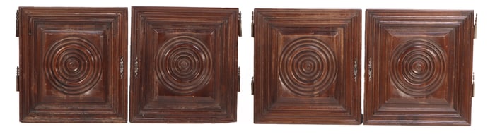 FOUR SUBSTANTIAL WALNUT CABINET DOORS IN THE MANNER OF CHARLES DUDOUYT.