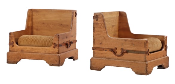 PAIR OF GOUGE CARVED FRENCH LOUNGE CHAIRS WITH LOOSE CUSHION UPHOLSTERY AND IRON MOUNTS  C 1960.