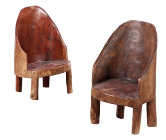 A PAIR OF SOLID WOOD NAGA CHAIRS.