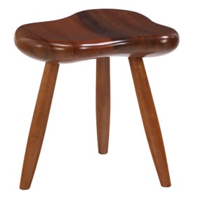 AMERICAN WALNUT STUDIO STOOL HAVING A SHAPED TOP.