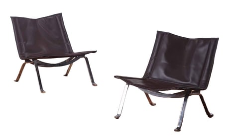 PAIR LEATHER AND STEEL LOUNGE CHAIRS IN THE MANNER OF POUL KJAERHOLME C 1990.
