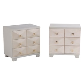 A PAIR OF ROBSJOHN-GIBBINGS STYLE PAINTED THREE DRAWER CHESTS HAVING SCULPTURAL DRAWER FRONTS AND