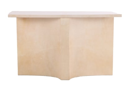 A PARCHMENT COVERED CONSOLE TABLE HAVING A DOUBLE CONCAVE DESIGN.