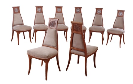 EIGHT CARVED DINING CHAIRS IN THE MANNER OF JAMES MONT C 1960.