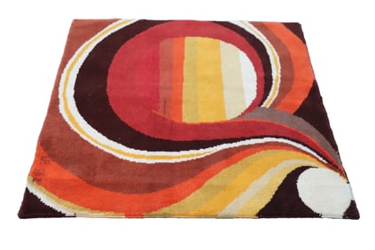A SIGNED ISRAELI RUG HAVING GRAPHIC SWIRL DESIGN C.1970S